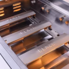 Detailed view of cast stainless steel burners on Blaze LTE+ Built-In NG Grill with IR Burner