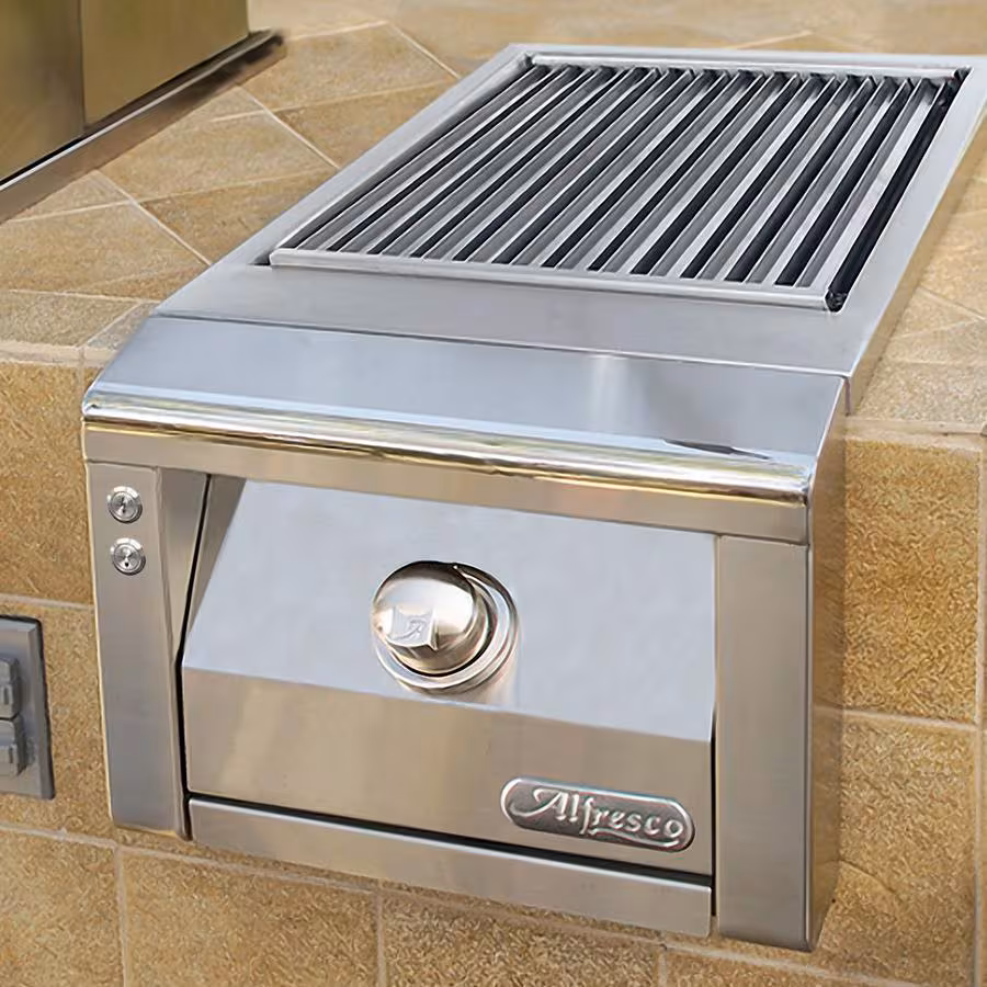 Alfresco sear zone burner built into granite countertop with brushed metal controls