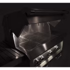 Hestan Built-In Grill with — LED-lit control knobs glowing at night